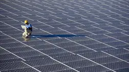 a man inspecting solar panels a man inspecting solar panels